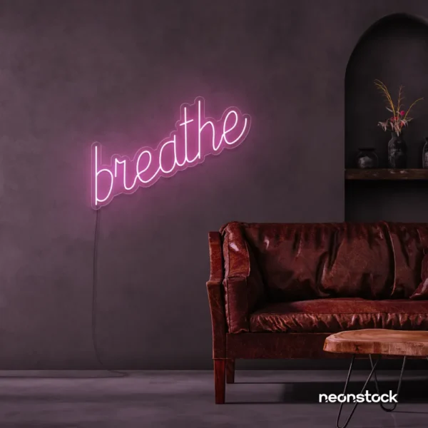 Breathe neon sign in baby pink for meditation rooms, yoga studios, and calming home decor.