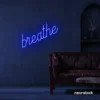 Breathe neon sign in dark blue for meditation rooms, yoga studios, and calming home decor.
