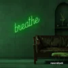 Breathe neon sign in deep green for meditation rooms, yoga studios, and calming home decor.