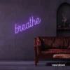 Breathe neon sign in purple for meditation rooms, yoga studios, and calming home decor.