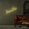 Breathe neon sign in warm white for meditation rooms, yoga studios, and calming home decor.