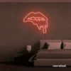 Drip lip neon sign in peachy pink for glam rooms, modern wall art, and beauty salon decor.