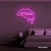 Drip lip neon sign in pink for glam rooms, modern wall art, and beauty salon decor.