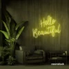 Hello Beautiful neon sign in lemon yellow script font for salon styling walls and glam vanity decor.
