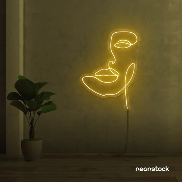 Abstract face neon sign in golden yellow for beauty salons, nail studios, and spa wall decor.
