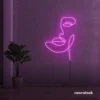 Abstract face neon sign in pink for beauty salons, nail studios, and spa wall decor.