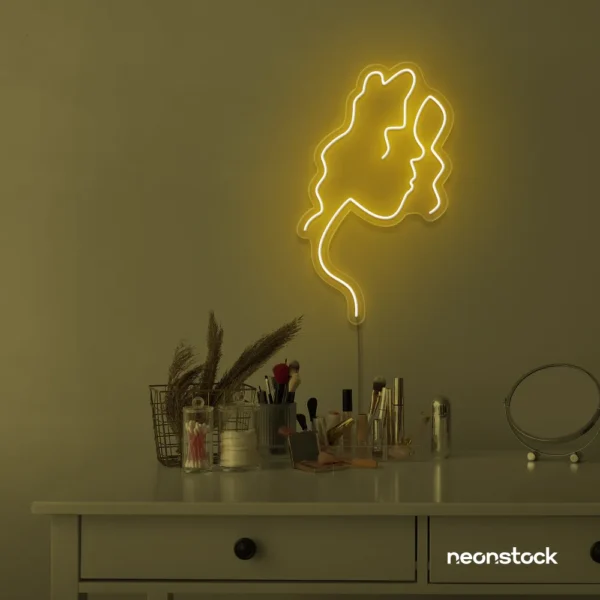 Abstract woman silhouette neon sign in golden yellow for salons, studios, and feminine wall decor.