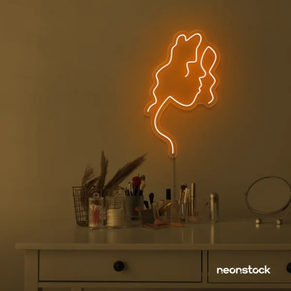 Abstract woman silhouette neon sign in orange for salons, studios, and feminine wall decor.