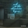 And So The Adventure Begins neon sign in ice blue for wedding decor, new beginnings, and celebration walls.