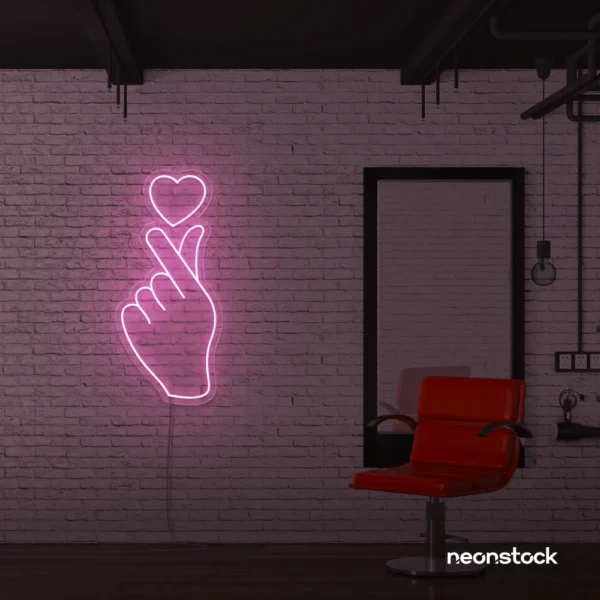 Finger heart neon sign in baby pink for bedroom and dorm room decor