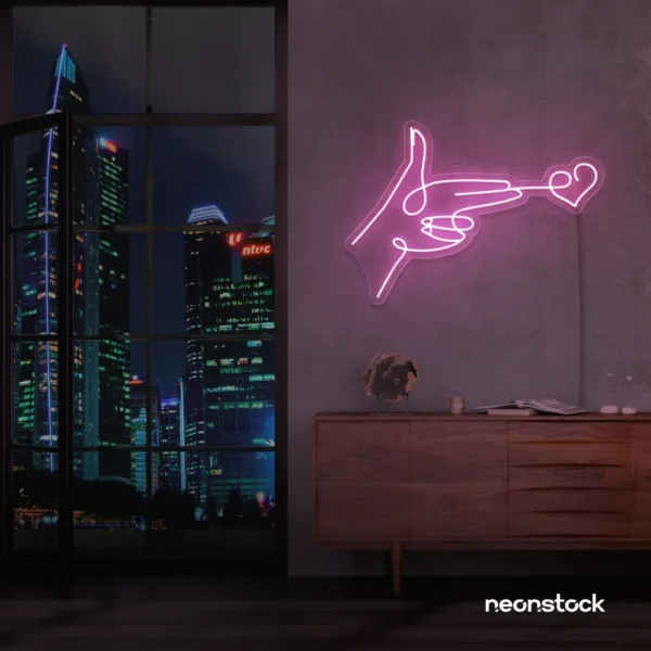 Hands shooting heart neon sign in baby pink – romantic LED wall decor.