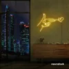 Hands shooting heart neon sign in golden yellow – romantic LED wall decor.