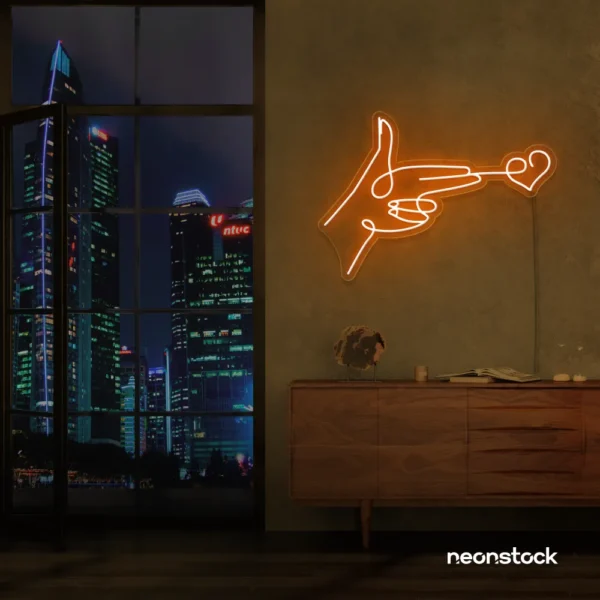 Hands shooting heart neon sign in orange – romantic LED wall decor.
