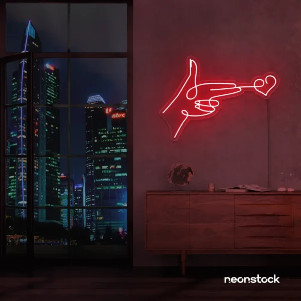 Hands shooting heart neon sign in red – romantic LED wall decor.