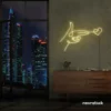 Hands shooting heart neon sign in warm white – romantic LED wall decor.
