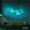 Hands neon sign in mint green – modern wall art symbolizing connection and emotion.