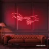 Hands neon sign in red – modern wall art symbolizing connection and emotion.