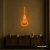 Hanging bulb neon sign in orange for cafes, offices, and creative spaces.