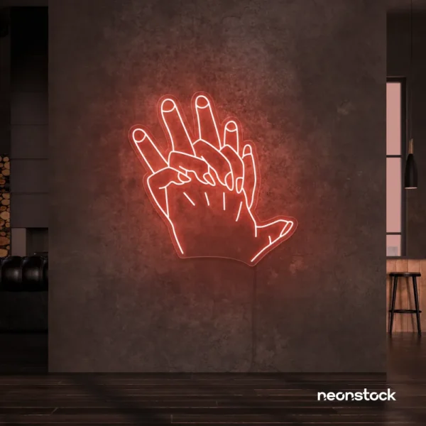 Holding hands neon sign in peachy pink – emotional LED wall decor.