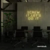 Screw It Let's Do It neon sign in warm white for fearless office decor, bold bedroom walls, and startup energy.
