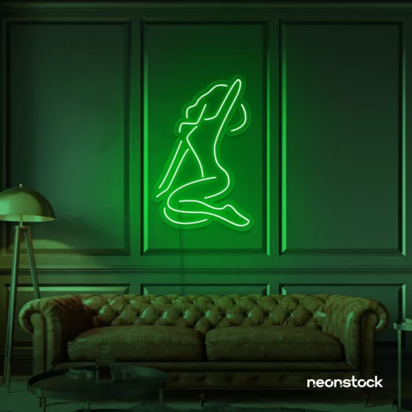 Sitting woman neon sign in deep green for minimalist wall art and feminine home decor.