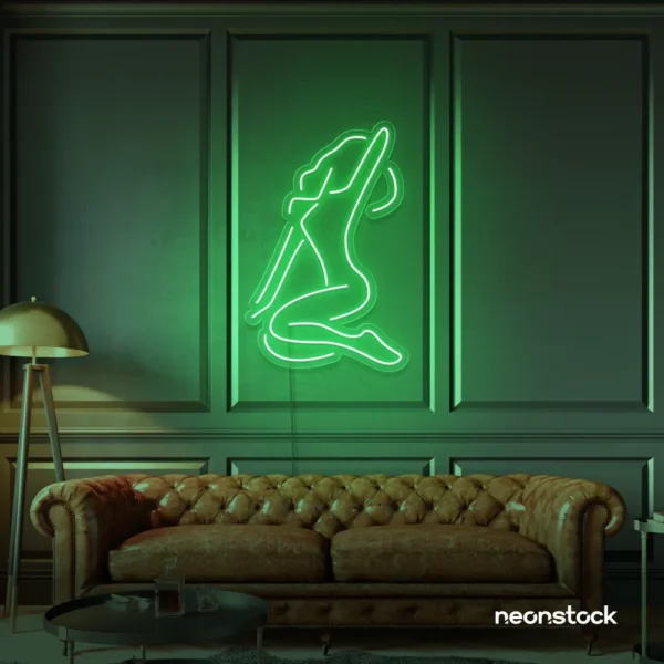 Sitting woman neon sign in green for minimalist wall art and feminine home decor.