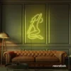 Sitting woman neon sign in lemon yellow for minimalist wall art and feminine home decor.
