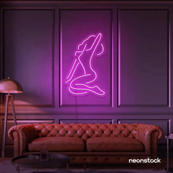 Sitting woman neon sign in pink for minimalist wall art and feminine home decor.