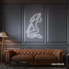 Sitting woman neon sign in white for minimalist wall art and feminine home decor.