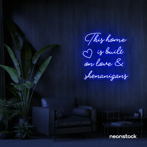 This Home Is Built on Love and Shenanigans neon sign in dark blue for family walls, living rooms, and cozy decor.