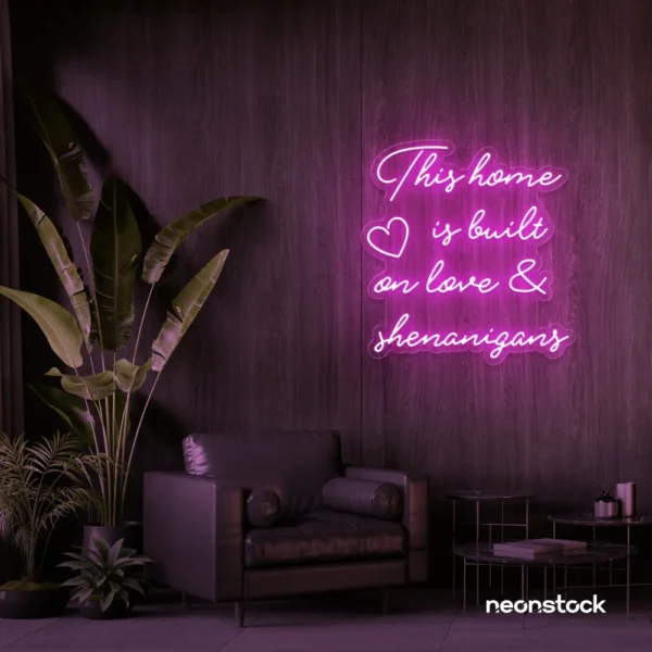 This Home Is Built on Love and Shenanigans neon sign in pink for family walls, living rooms, and cozy decor.