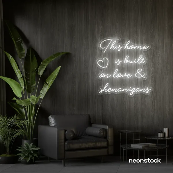This Home Is Built on Love and Shenanigans neon sign in white for family walls, living rooms, and cozy decor.