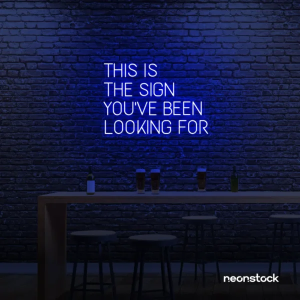 This Is The Sign You’ve Been Looking For neon sign in dark blue for modern wall decor and motivational rooms.