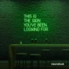 This Is The Sign You’ve Been Looking For neon sign in deep green for modern wall decor and motivational rooms.
