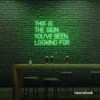 This Is The Sign You’ve Been Looking For neon sign in green for modern wall decor and motivational rooms.