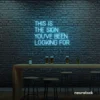 This Is The Sign You’ve Been Looking For neon sign in ice blue for modern wall decor and motivational rooms.