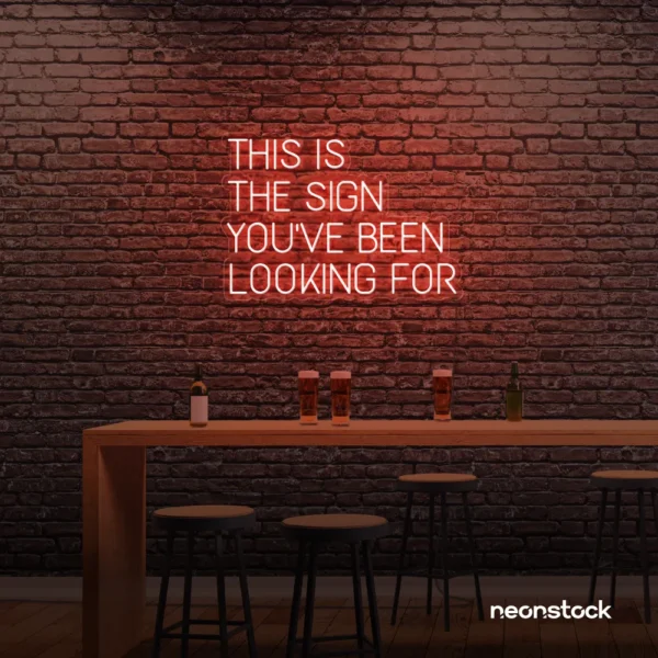 This Is The Sign You’ve Been Looking For neon sign in peachy pink for modern wall decor and motivational rooms.