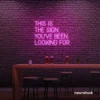 This Is The Sign You’ve Been Looking For neon sign in pink for modern wall decor and motivational rooms.