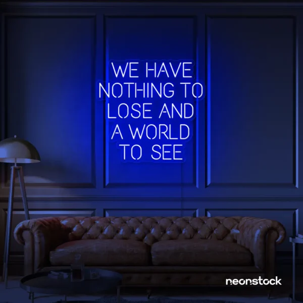 We Have Nothing to Lose and a World to See neon sign in dark blue for travel wall art and decor lovers.