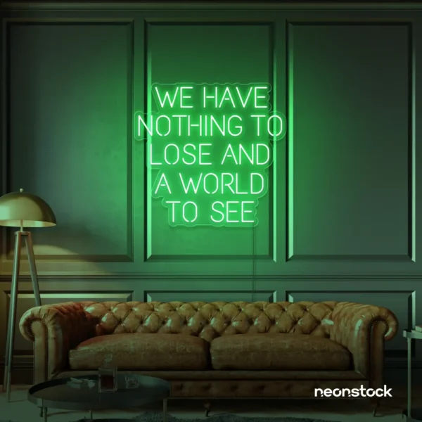 We Have Nothing to Lose and a World to See neon sign in green for travel wall art and decor lovers.