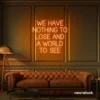 We Have Nothing to Lose and a World to See neon sign in orange for travel wall art and decor lovers.