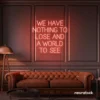 We Have Nothing to Lose and a World to See neon sign in peachy pink for travel wall art and decor lovers.