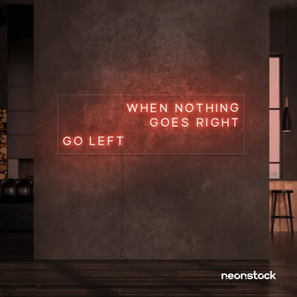 When Nothing Goes Right Go Left neon sign in peachy pink for motivational spaces and creative rooms.