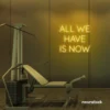 All We Have Is Now neon sign in golden yellow for modern wall decor, dorms, and cozy interiors.
