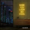 Babe You Look So Cool neon sign in golden yellow for glam rooms, salons, and modern home decor.