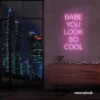 Babe You Look So Cool neon sign in baby pink for glam rooms, salons, and modern home decor.
