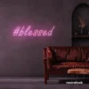 Blessed neon sign in baby pink for spiritual decor, homes, and motivational spaces.