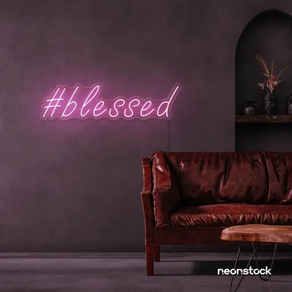 Blessed neon sign in baby pink for spiritual decor, homes, and motivational spaces.
