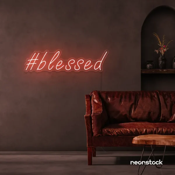 Blessed neon sign in peachy pink for spiritual decor, homes, and motivational spaces.