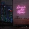 Break the Rules neon sign in baby pink for rebellious decor, creative studios, and bold interiors.